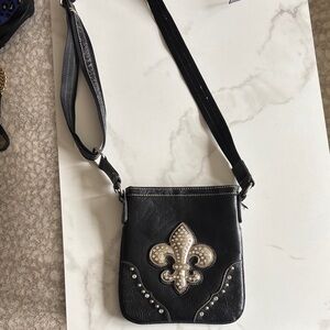 Black Crossbody Bag with Fleur-de-Lis Design